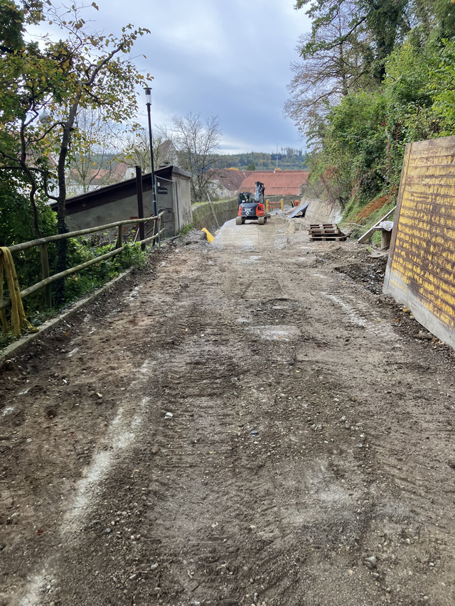 A photograph of a road being worked